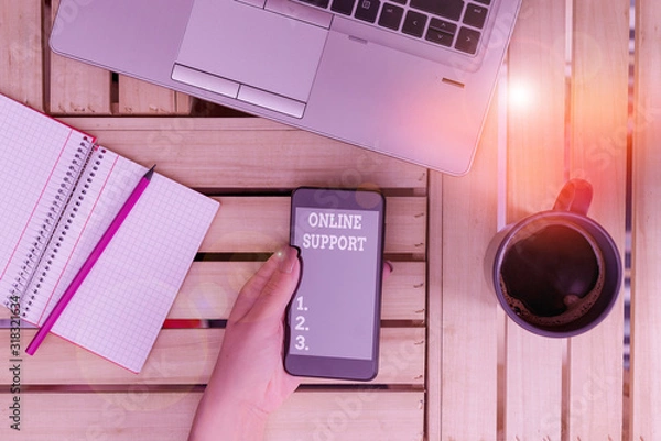 Fototapeta Conceptual hand writing showing Online Support. Concept meaning electronic usually webbased version of customer service woman with laptop smartphone and office supplies technology
