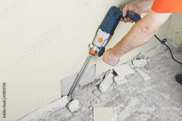 Obraz House-builder working with a perforator
