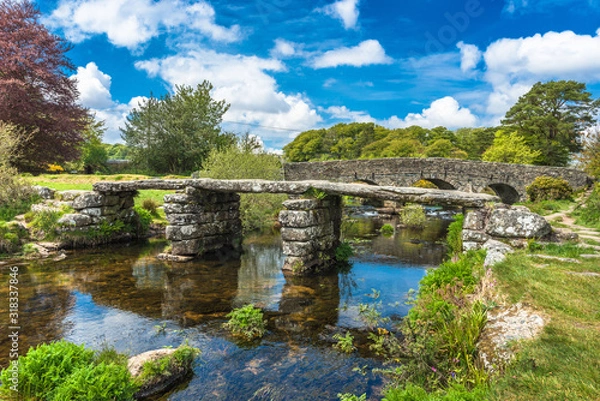 Fototapeta Medieval clapper bridge over the East Dart River at Postbridge on Dartmoor in Devon, West Country, England, UK
