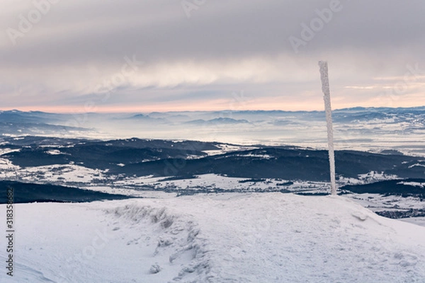 Fototapeta Cloudy winter day in mountains