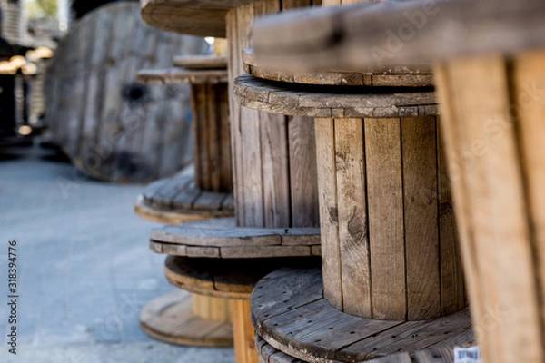 Fototapeta Close up shot of some big empty cable reels.