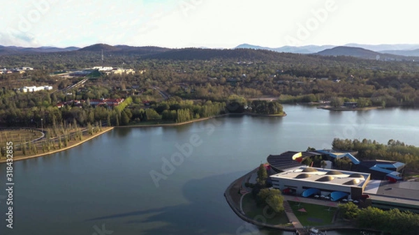 Fototapeta Aerial view of Canberra City, Australia, looking over Lake Burley Griffin and Acton Peninsula toward Australian Parliament House on a sunny afternoon 