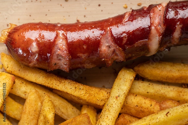 Obraz Fried sausage with french fries served on plate