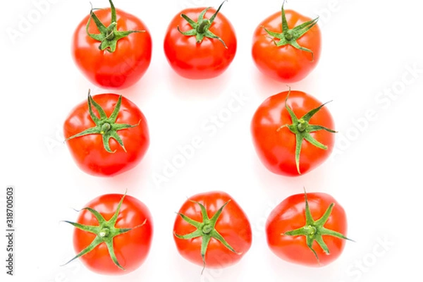 Fototapeta Group of delicious ripe red tomatoes lie in rows on white background. Top view. Healthy and organic food concept. 