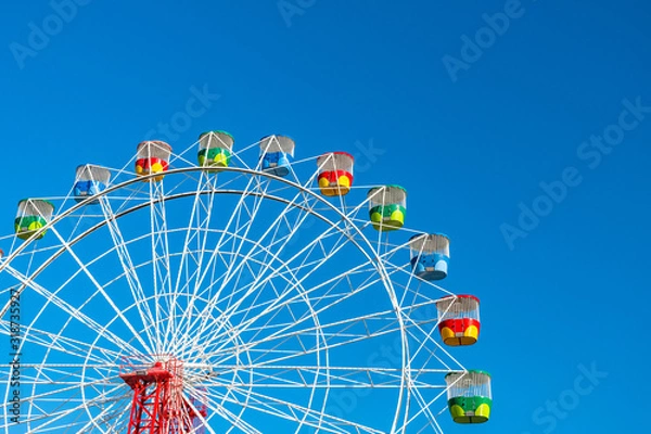 Obraz Ferris wheel on clear blue sky background