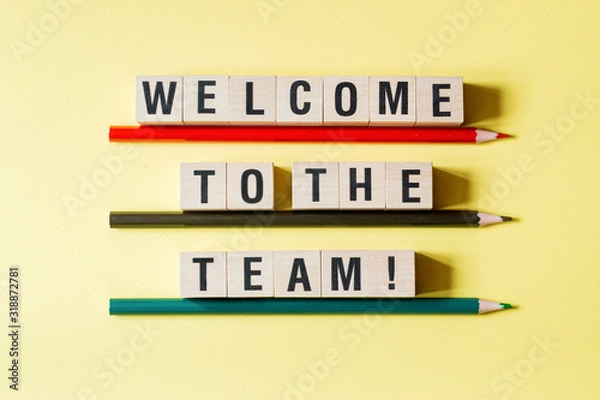 Fototapeta Welcome to the team word concept on cubes