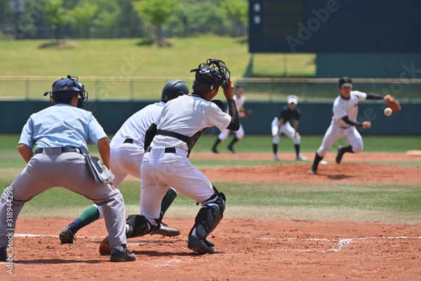 Obraz 高校野球の試合でバント処理をするピッチャー