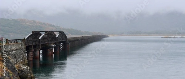 Obraz Barmouth railway bridge over the Mawddach in Wales on a cloudy day