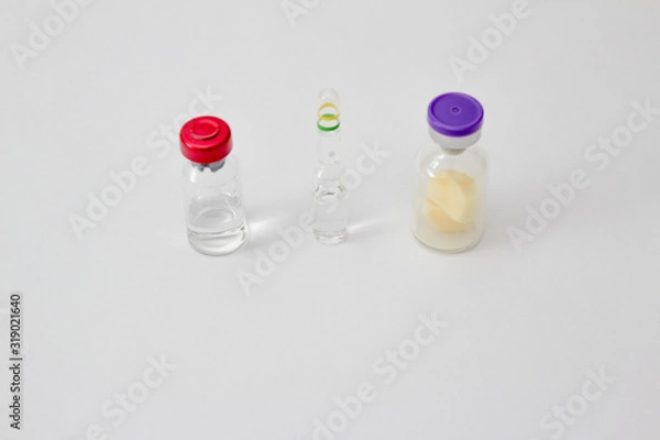 Fototapeta Three types of phials with medication for viruses, coronavirus