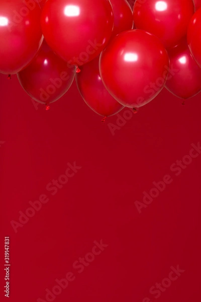 Obraz red helium balloons on red background
