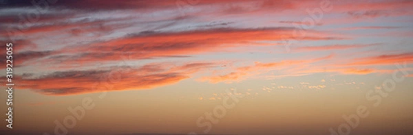 Obraz Long horizontal BANNER. Sunset sky with long pink clouds