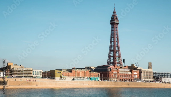 Obraz Blackpool, England, 19/09/2019 Beautiful landscape image of the the famous Blackpool Tower on the seaside promenade of the north west, a hotspot for holidays and British tourism. Blue sky and water