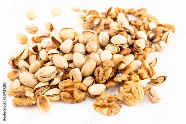 Obraz Pistachio nuts with nuts on the white background