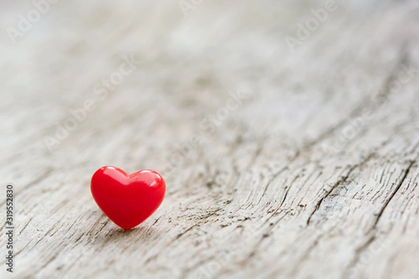 Fototapeta Valentines Day concept -  Red hearts on plank wooden background with copy space.