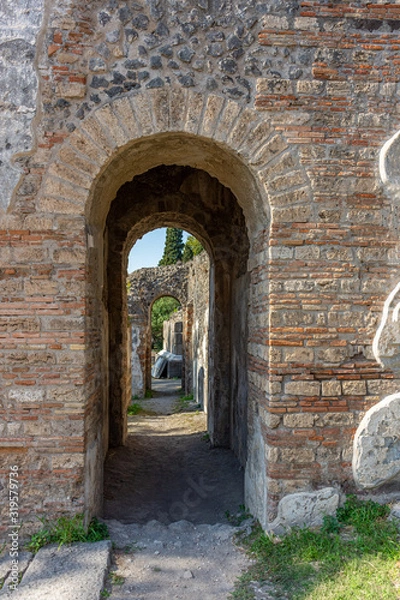 Fototapeta Italy, Pompeii, archaeological area, remains of the city buried by the eruption of ashes and rocks of Vesuvius in 79.  Way of the Tombs