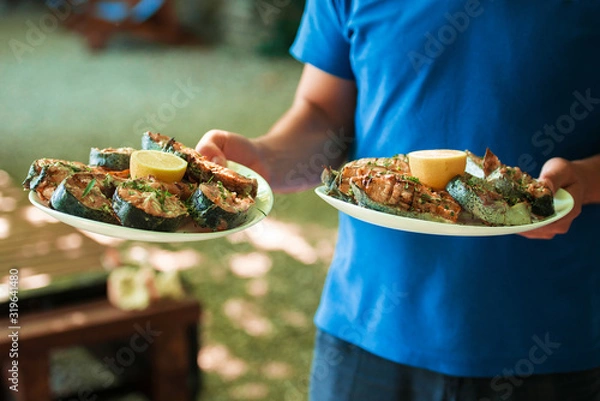 Obraz fried fish with lemon is ready for the table