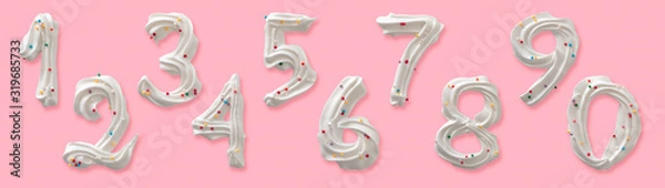 Fototapeta Set of ten Arabic numerals, white icing edible figures, cream, meringue with colored sugar sprinkles. Top view isolated on pastel pink background. Confectionery or holidays, decorative design.