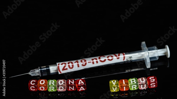 Fototapeta Colorful text "Corona virus" and   syringe have red text "(2019-nCoV)  put on  Black background. corona virus Concept.