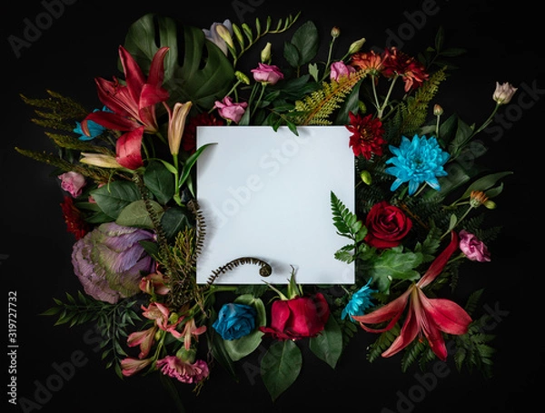 Fototapeta Creative layout made of flowers and leaves. Flat lay. Nature concept. Floral Greeting card. Colorful spring flower background with paper card note. Nature Trendy  Decorative Design.