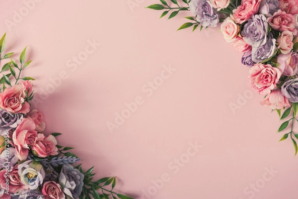 Fototapeta Creative arrangement of colorful flowers on pink background. Spring nature flat lay.