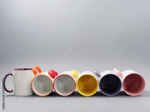 Obraz colored cups for sublimation in composition on a gray background
