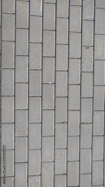 Fototapeta Paving stone texture - Concrete or cobble gray pavement slabs or stones for floor