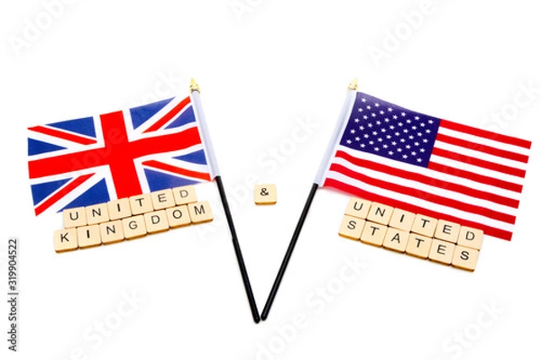 Fototapeta The flags of the United Kingdom and the United States isolated on a white background with a sign reading United Kingdom & United States