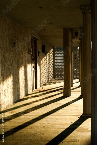 Fototapeta Sun setting on a empty portico