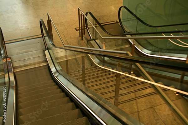 Fototapeta looking down on indoor escalator