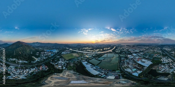 Fototapeta Aerial View of rural green fields in Hong Kong border at sunset