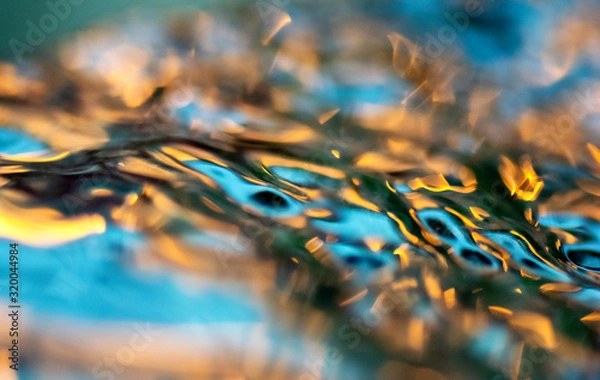 Fototapeta lights reflected on running water 
