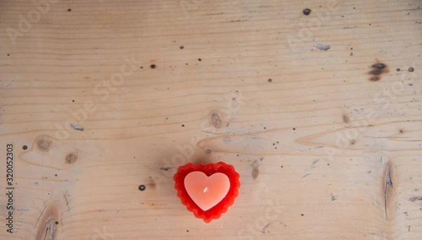 Obraz Heart shaped candle on wooden table