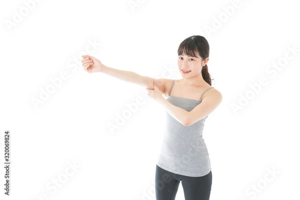 Fototapeta 筋肉を鍛える若い女性