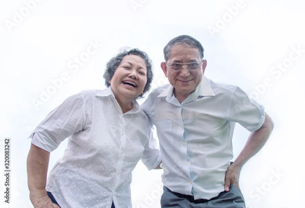 Fototapeta couple asian grandmother and grandmather smile from bottom view in happy emotion act on white background