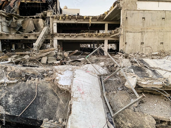 Fototapeta Ruins of a destroyed building in a city