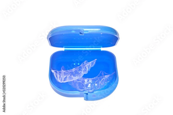 Fototapeta Set of individual dental trays for whitening in blue container