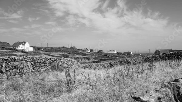 Fototapeta Black and white shot of the rugged stone landscape on Inishmaan, one of the Aran Islands off the west coast of Galway, Ireland.