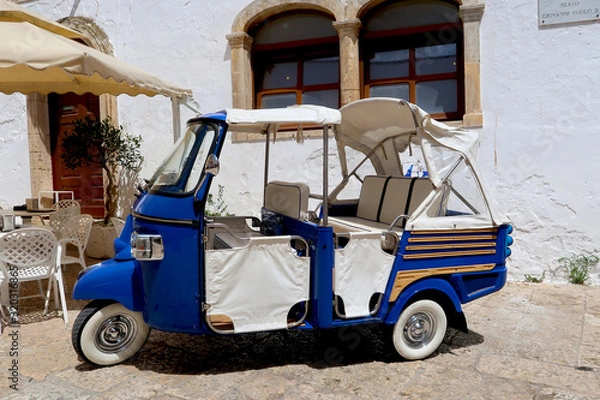 Obraz Tuk-tuk, small car used mainly for tourists, standing in the street of Ostuni town, Apulia region, Italy, Adriatic Sea