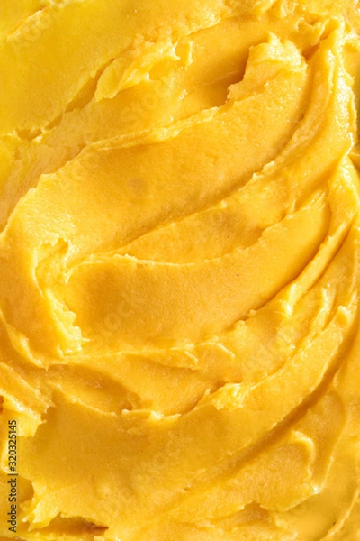Fototapeta Top view of soft mango sorbet surface