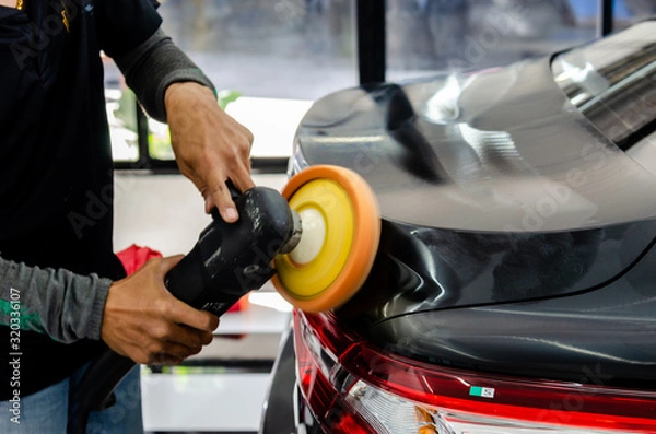 Fototapeta hands holding the work tool polish car.