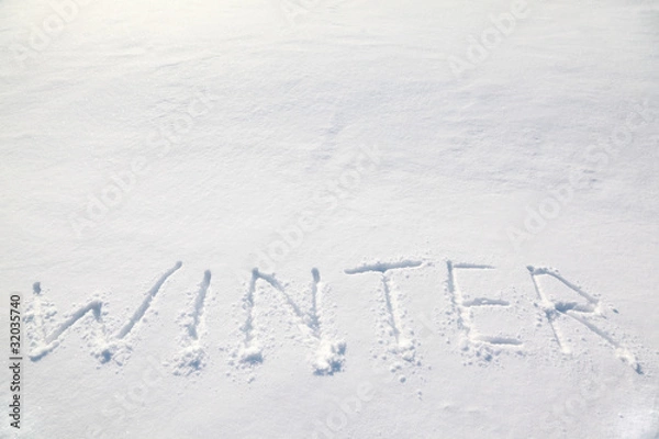 Fototapeta big words "winter" on white cold snow field