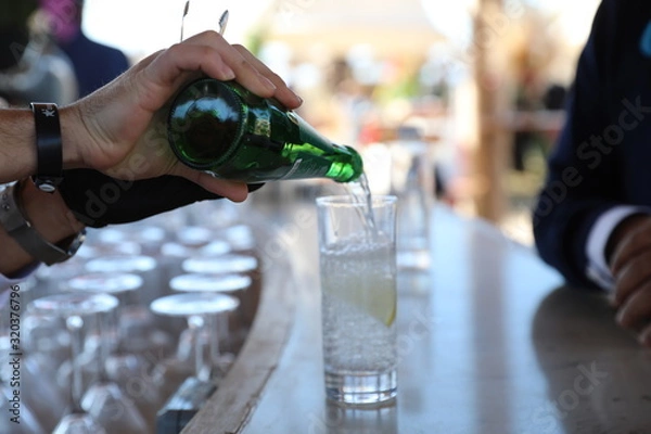 Obraz close up barman hands are preparing drink
