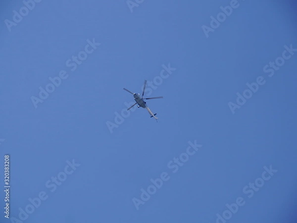 Obraz Helicopter in the blue sky 