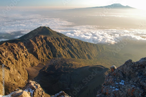 Fototapeta Mount Meru and its ash cone above clouds. Arusha  Tanzania. Africa. 