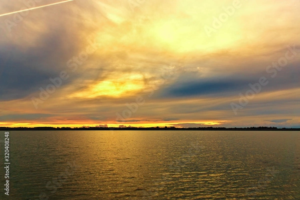 Fototapeta Lake at sunset on a summer evening. Russia, Kostroma region, Lake Sorozhye.