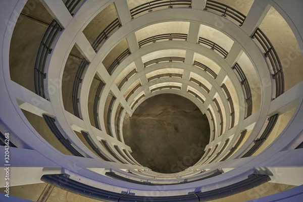 Fototapeta view from above into a circular parking ramp made of concrete