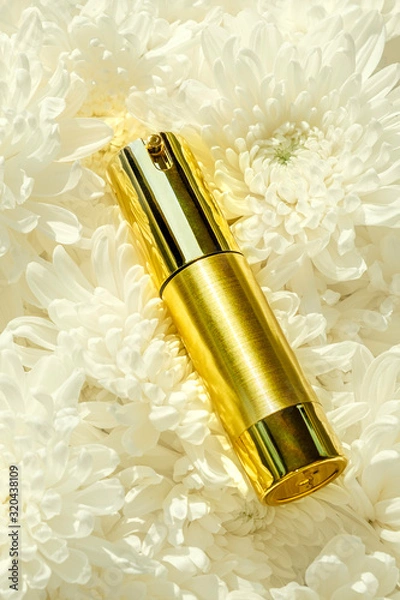 Obraz Cosmetic Bottle on white flower