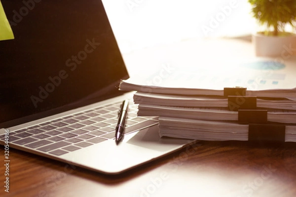 Fototapeta Stack of documents placed on a business desk in a business office.