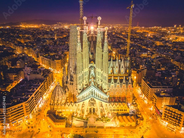 Fototapeta La Sagrada Familia in night - cathedral designed by Antoni Gaudi, which is being build since 1882 and is not finished yet February 14, 2019, in Barcelon
