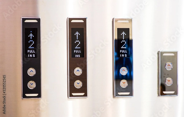 Fototapeta Different buttons in modern metal elevator